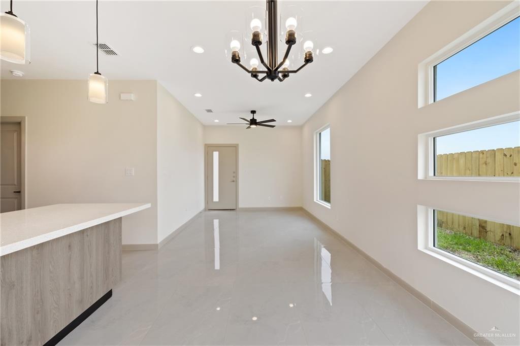 1806 West Violet Drive, Unit 2 Pharr, TX 78577 - Photo 2 of 11 a view of an empty room with wooden floor and a window