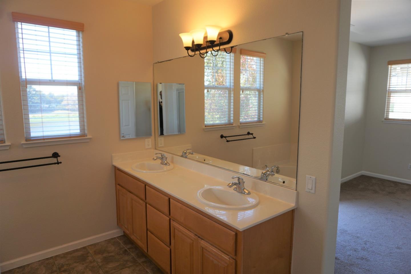 45 Pelican Drive Watsonville, CA 95076 - Photo 15 of 21 a bathroom with a sink and a mirror