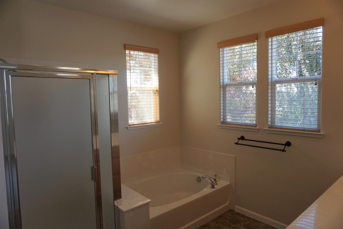 45 Pelican Drive Watsonville, CA 95076 - Photo 16 of 21 a bathroom with a bathtub window and shower