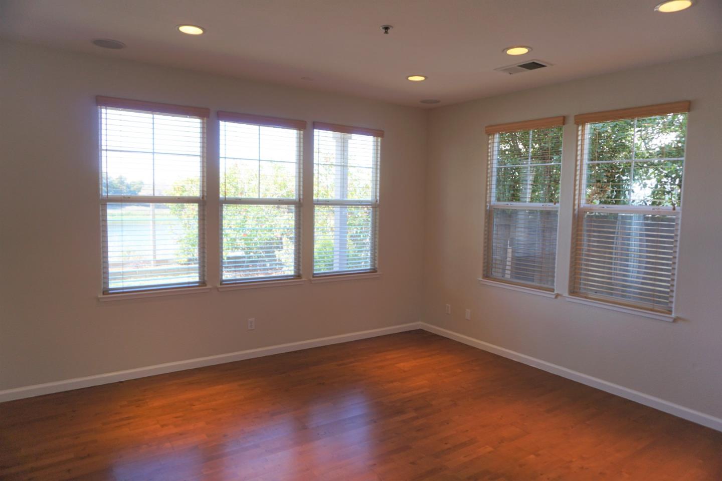 45 Pelican Drive Watsonville, CA 95076 - Photo 5 of 21 an empty room with wooden floor and windows