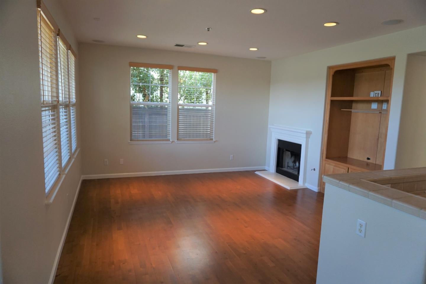 45 Pelican Drive Watsonville, CA 95076 - Photo 6 of 21 an empty room with wooden floor and a window
