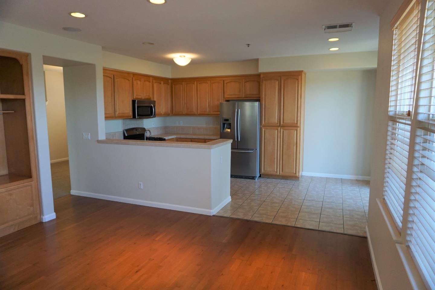 45 Pelican Drive Watsonville, CA 95076 - Photo 7 of 21 a kitchen with stainless steel appliances a refrigerator and a stove top oven