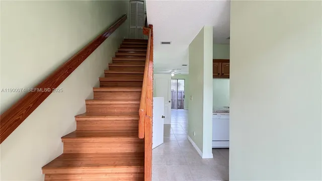 a view of an entryway with wooden floor