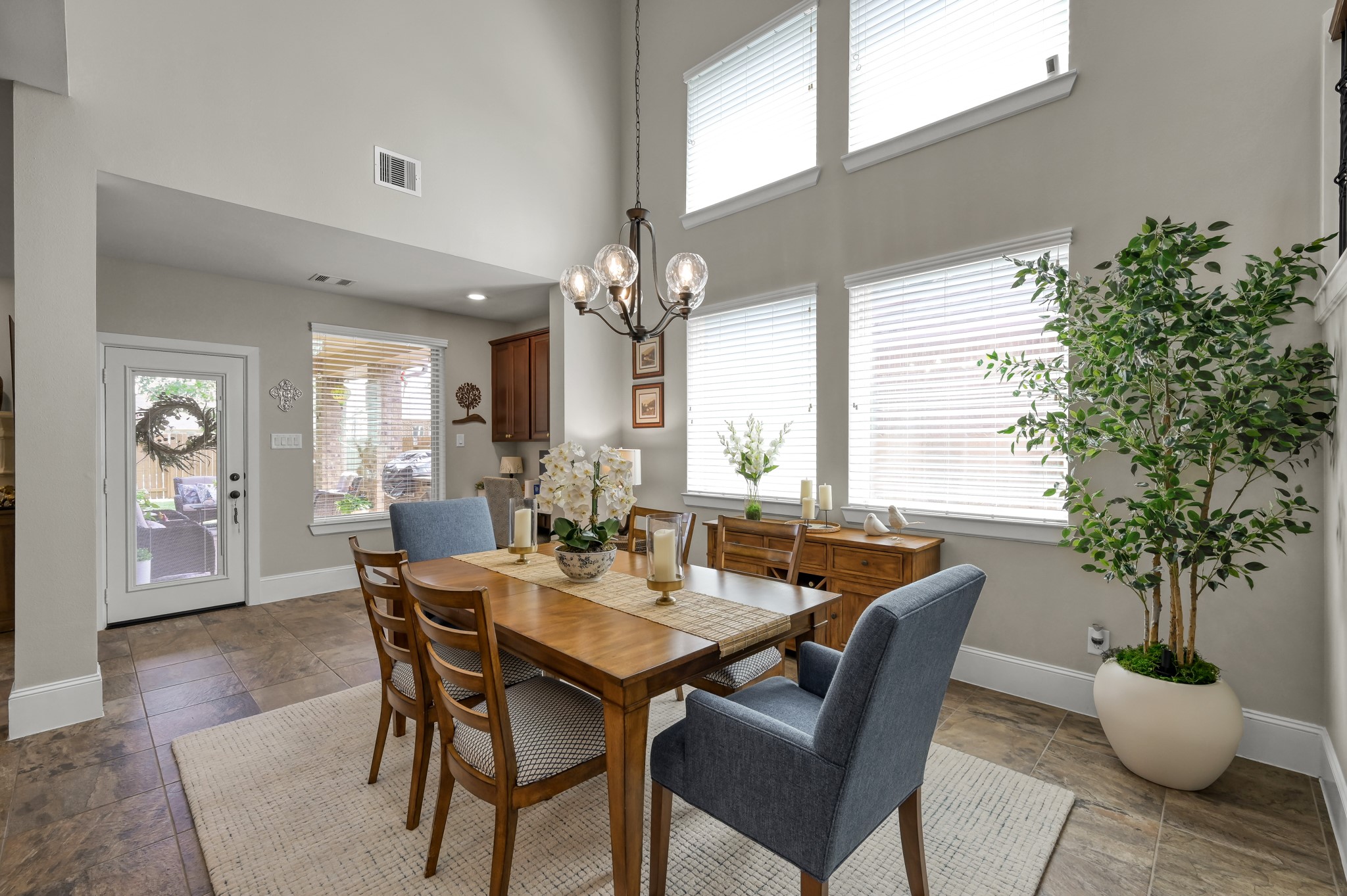 31742 Serrano Bluff Lane Spring, TX 77386 - Photo 7 of 40 Formal dining w/ soaring 2 story ceilings immersed with natural light.