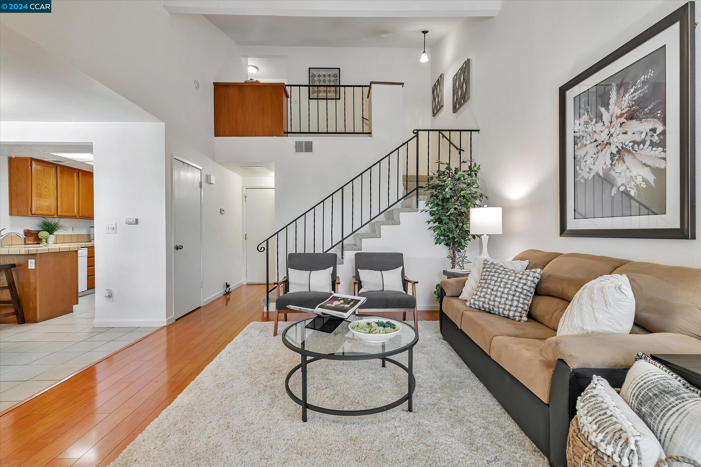 a living room with furniture and white walls