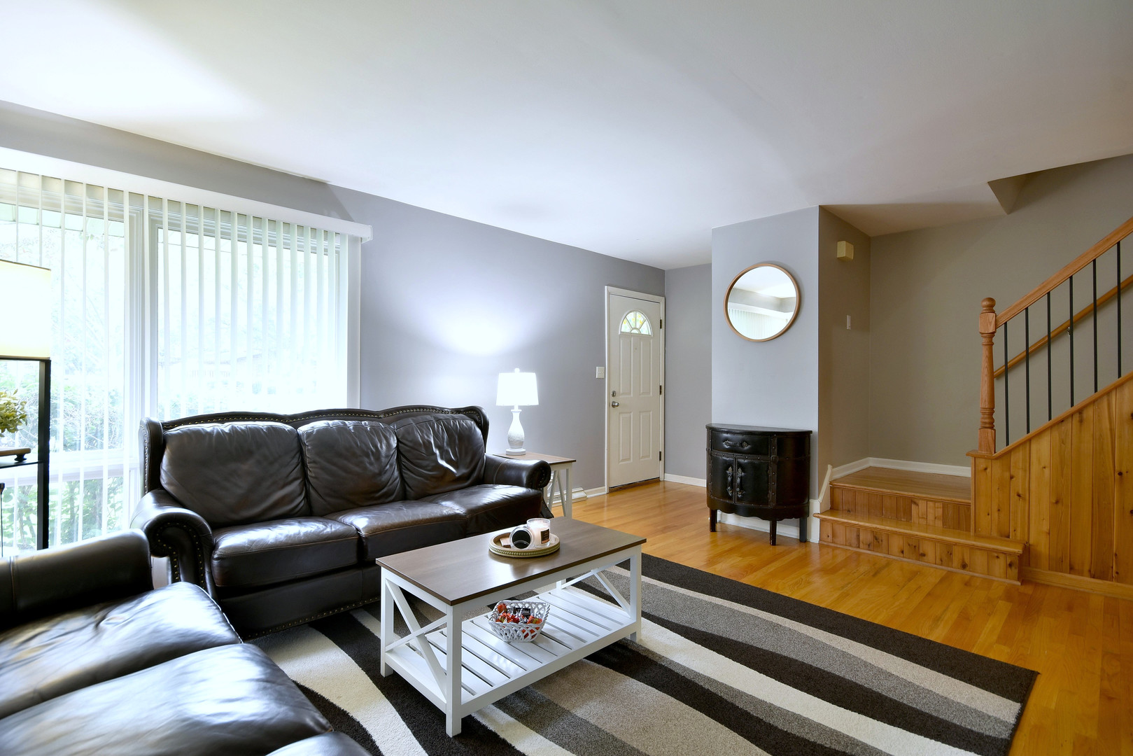 1042 North Wheeling Road, Unit 1042 Mount Prospect, IL 60056 - Photo 2 of 32 a living room with furniture fireplace and a window