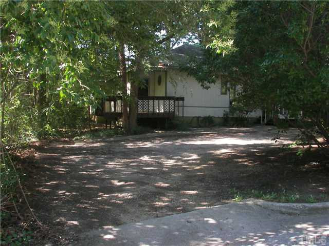 4031 Greenleaf Street, Unit 2 Raleigh, NC 27606 - Photo 1 of 13 a view of a house with a yard