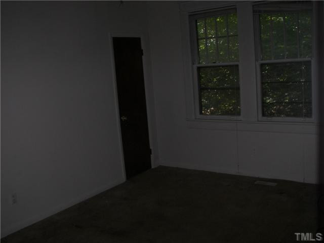 4031 Greenleaf Street, Unit 2 Raleigh, NC 27606 - Photo 11 of 13 a view of an empty room and window