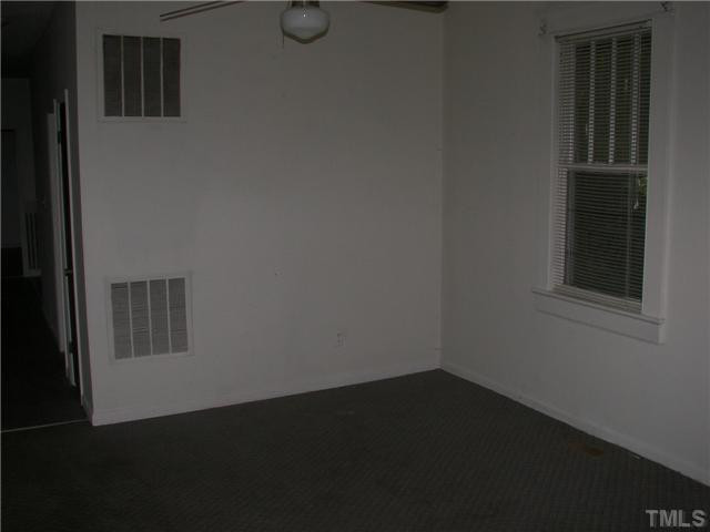 4031 Greenleaf Street, Unit 2 Raleigh, NC 27606 - Photo 2 of 13 a view of a closet area with wooden floor