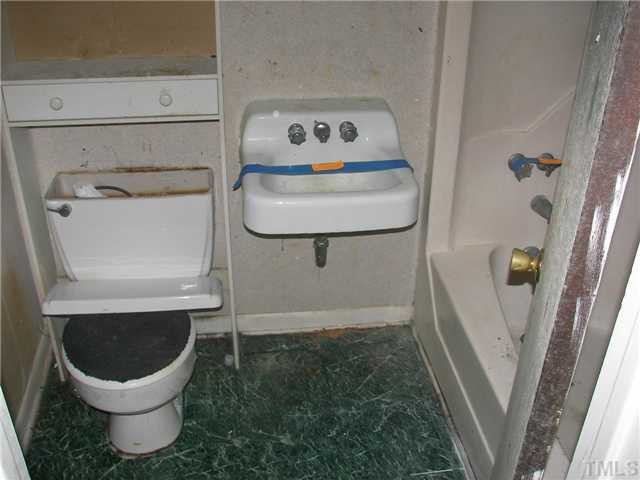 4031 Greenleaf Street, Unit 2 Raleigh, NC 27606 - Photo 4 of 13 a bathroom with a toilet and a sink