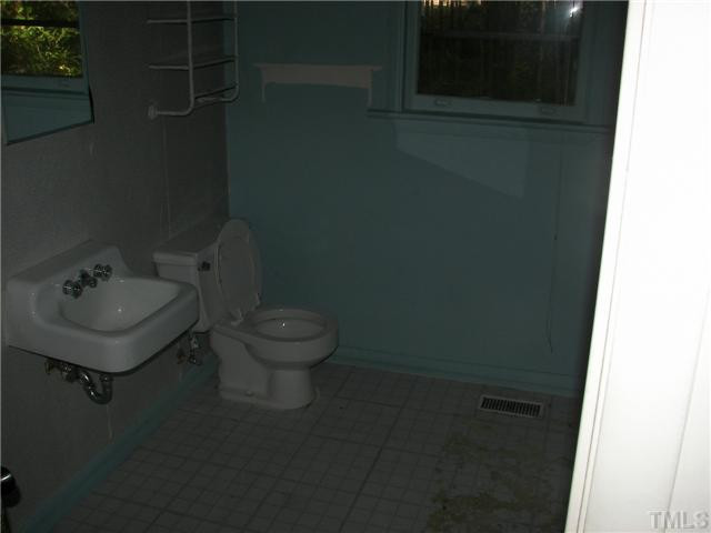 4031 Greenleaf Street, Unit 2 Raleigh, NC 27606 - Photo 5 of 13 a bathroom with a toilet and a sink