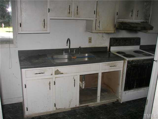 4031 Greenleaf Street, Unit 2 Raleigh, NC 27606 - Photo 6 of 13 a kitchen with a sink and cabinets