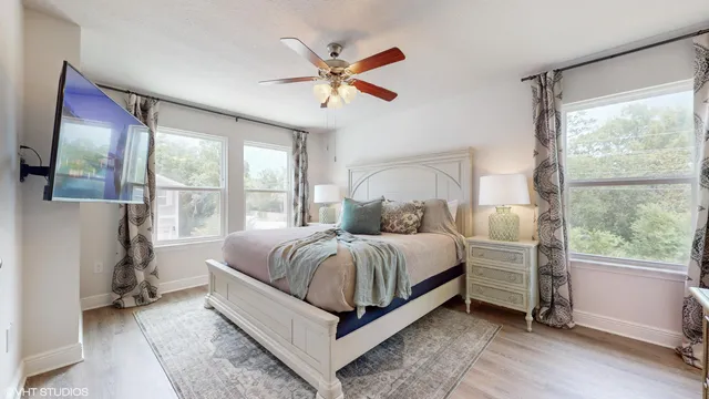 a bedroom with a bed and window