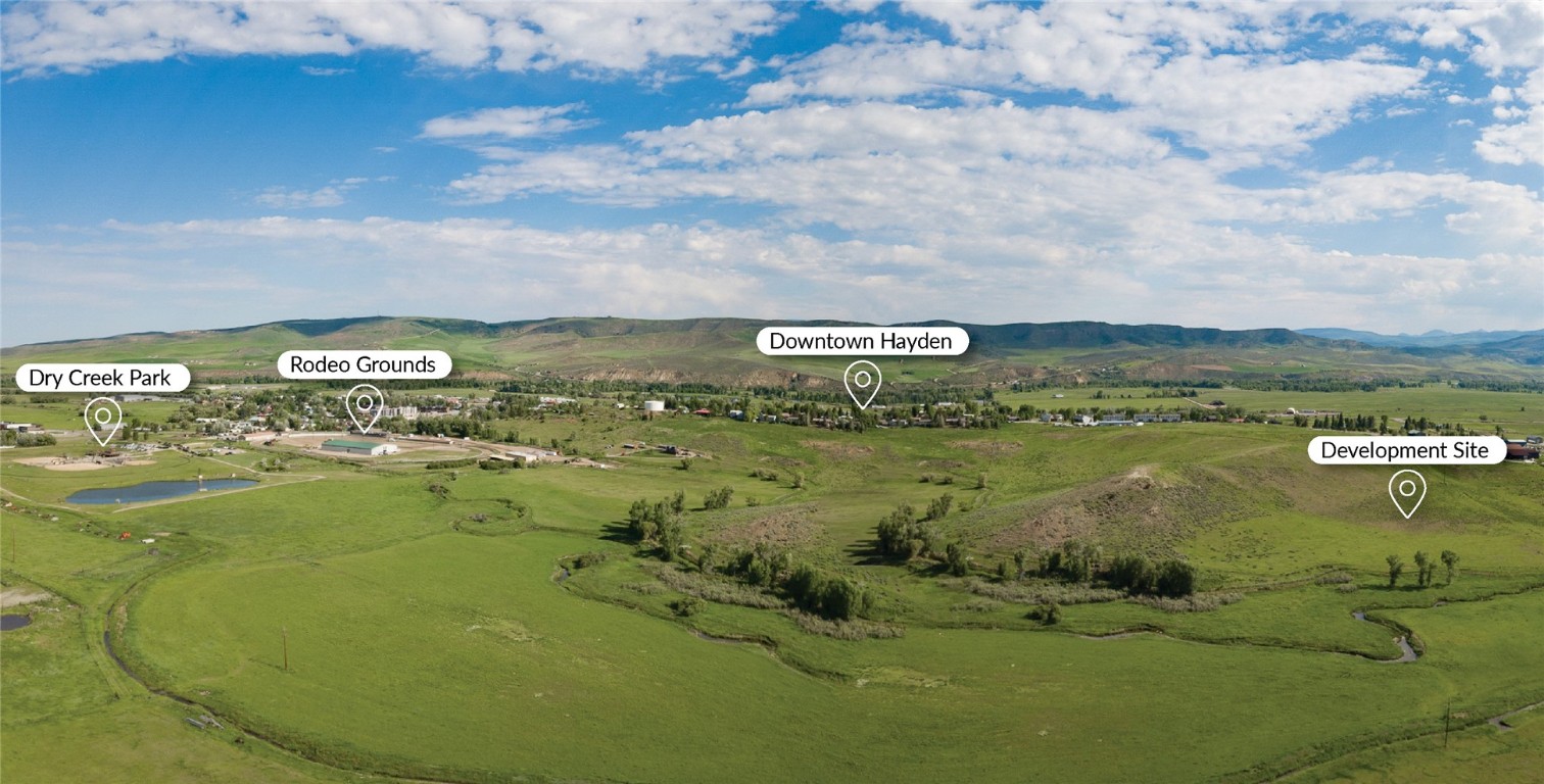 a view of a lake with houses in the back