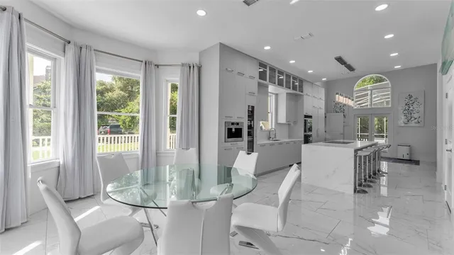 a bedroom with furniture and a flat screen tv