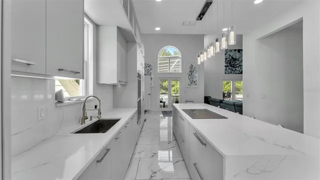 a kitchen with stainless steel appliances kitchen island a stove and a refrigerator