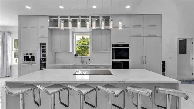 a bathroom with a large tub a sink shower and mirror