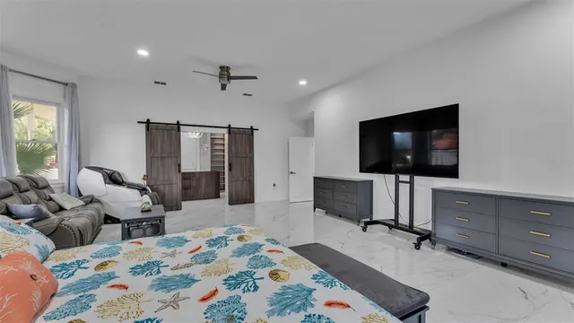 a bathroom with a sink toilet vanity and shower