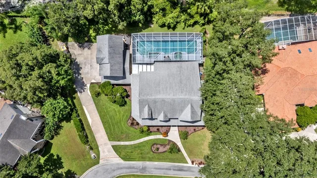 a view of house with yard and green space