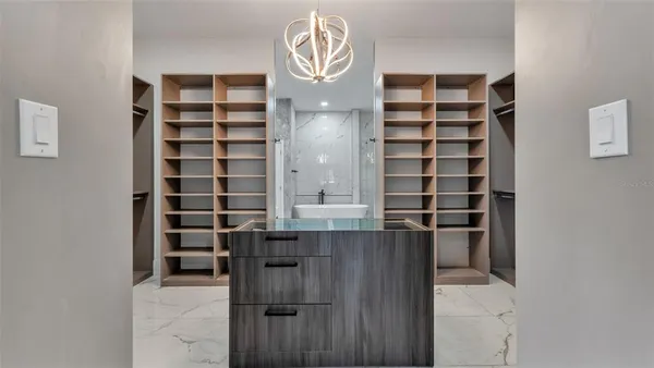 a living room with a bed furniture closet and window