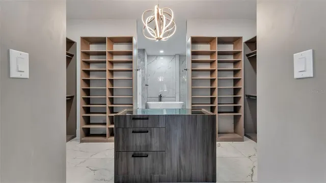 a living room with a bed furniture closet and window