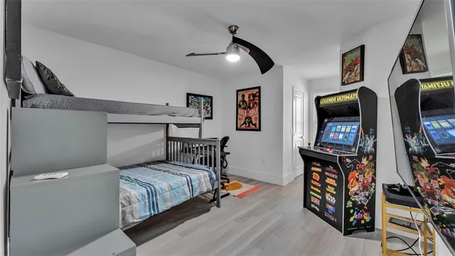 a kitchen that has a sink a stove and a wooden floor