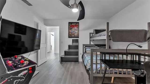 a kitchen with stainless steel appliances granite countertop a refrigerator a stove a sink and a microwave