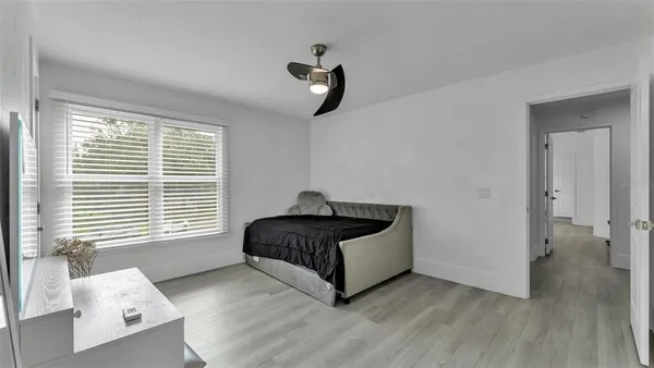 a front view of a house with a garden and yard