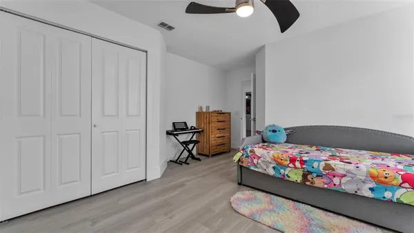 a view of a porch with furniture and a yard