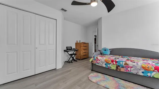 a view of a porch with furniture and a yard