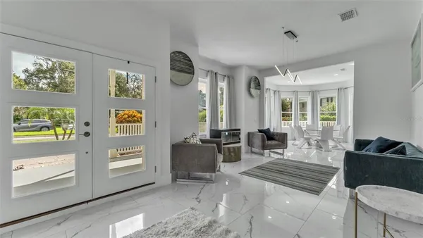 a view of a dining room with furniture window and outside view