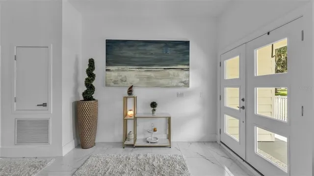 a kitchen with white cabinets and a stove