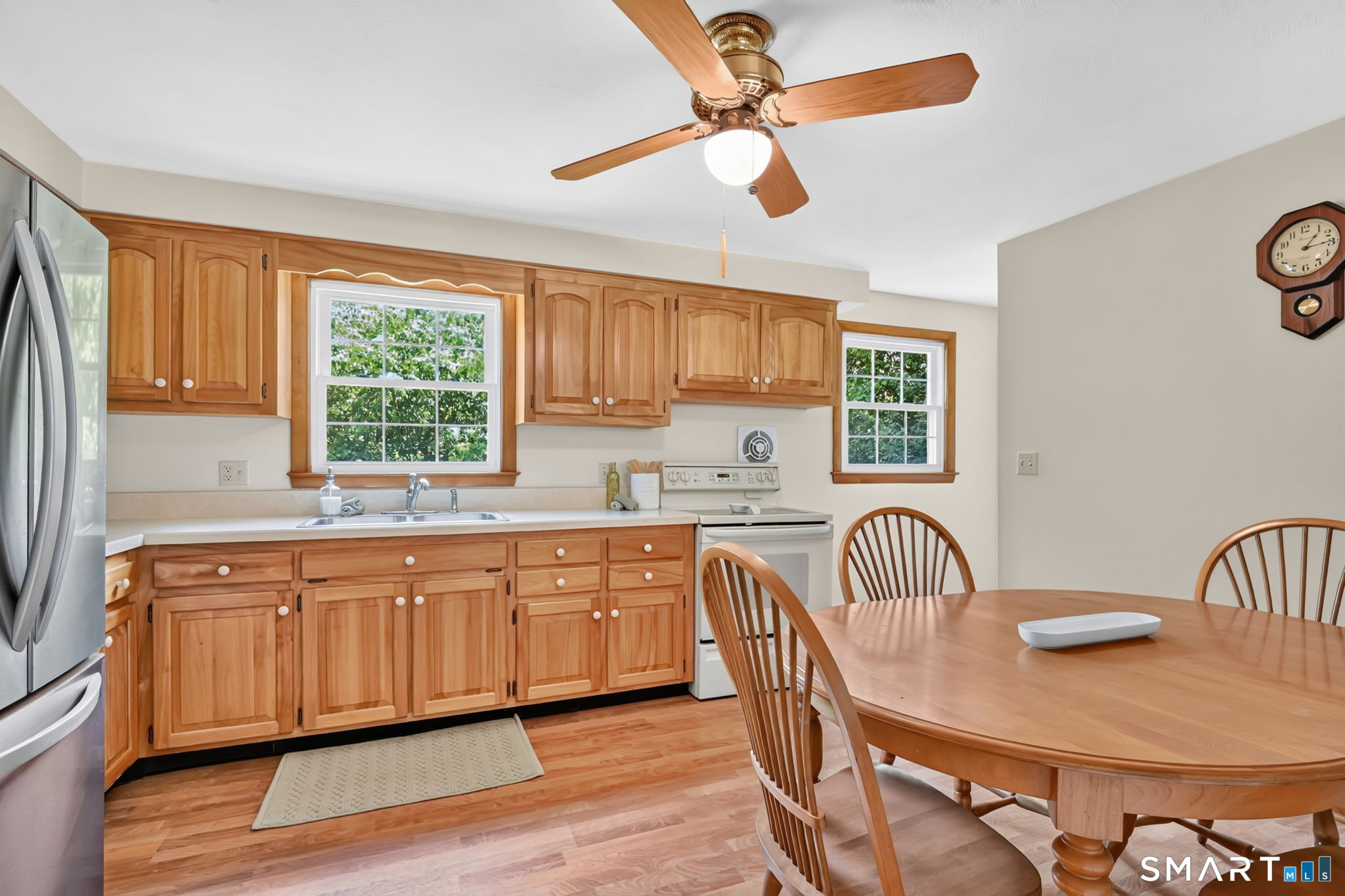 296 Phoenix Street Vernon, CT 06066 - Photo 7 of 34 a kitchen with sink cabinets and wooden floor