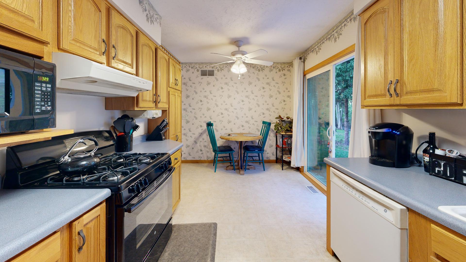 902 Charlotte Drive Normal, IL 61761 - Photo 5 of 35 a kitchen with a table and chairs