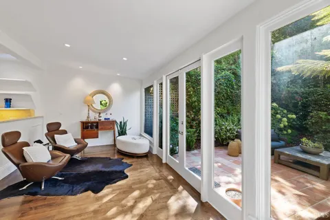 a living room with furniture and a rug