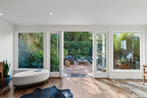 a bedroom with furniture and a window