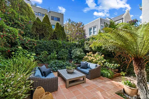 a bed room with a bed and a chair