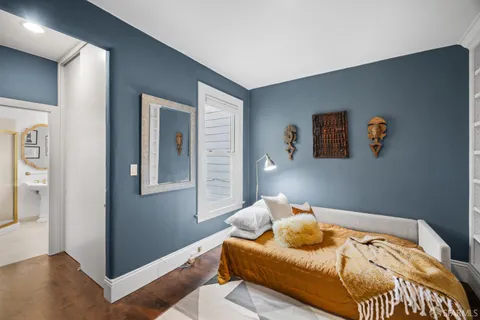 a bedroom with furniture and a bed