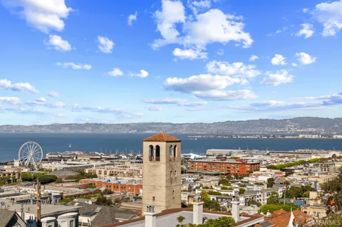 a view of a building with potted plants