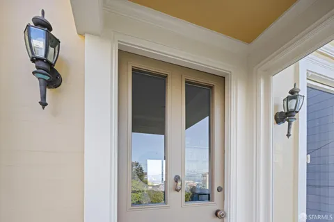 a living room with fireplace furniture and a wooden floor