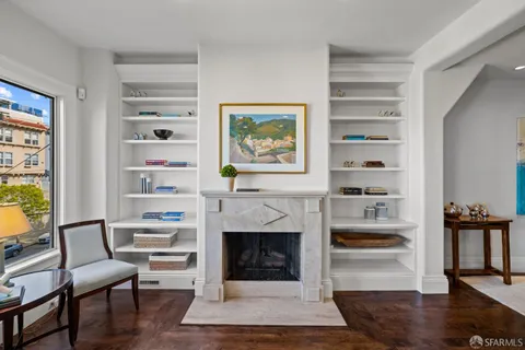 a kitchen with cabinets a stove and a wooden floors