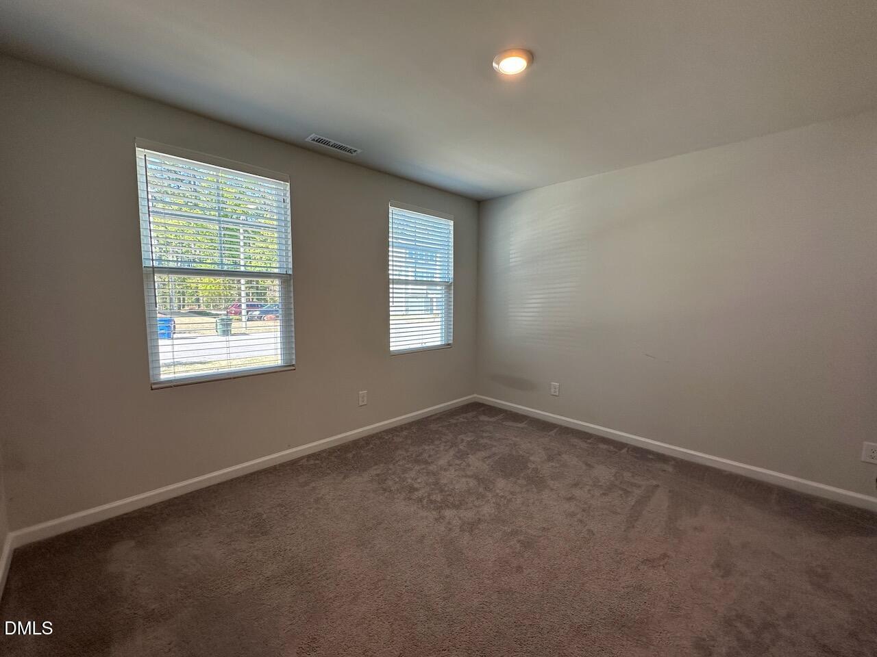 2521 Laurel Valley Way Raleigh, NC 27604 - Photo 4 of 25 an empty room with windows