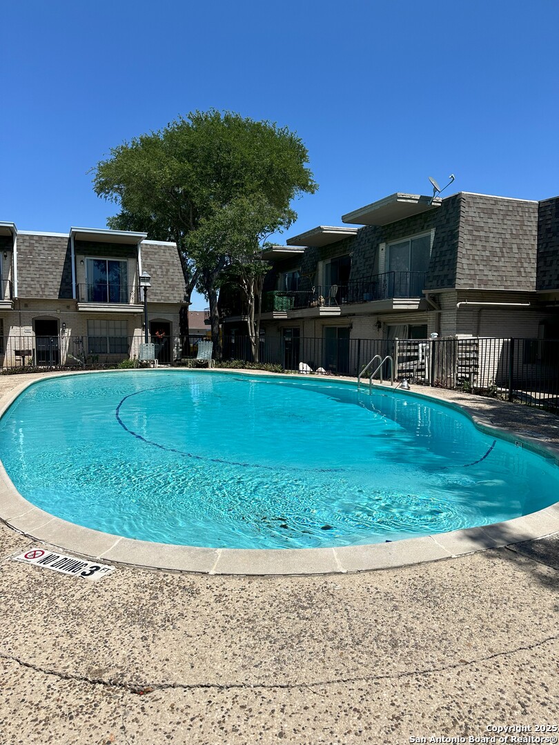 170 De Chantle Road, Unit 609 San Antonio, TX 78201 - Photo 14 of 20 a view of a house with a backyard porch and sitting area