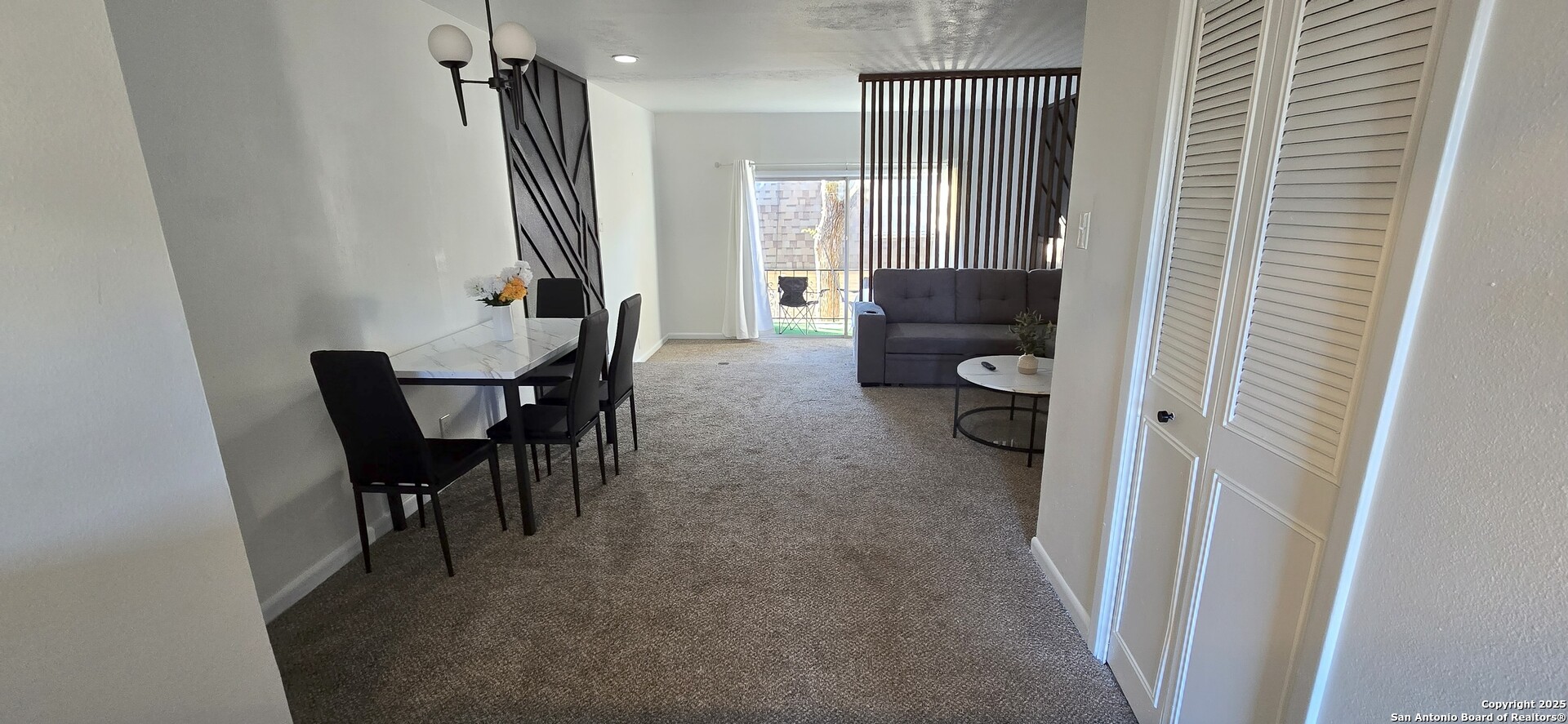 170 De Chantle Road, Unit 609 San Antonio, TX 78201 - Photo 4 of 20 a living room with furniture and a large window