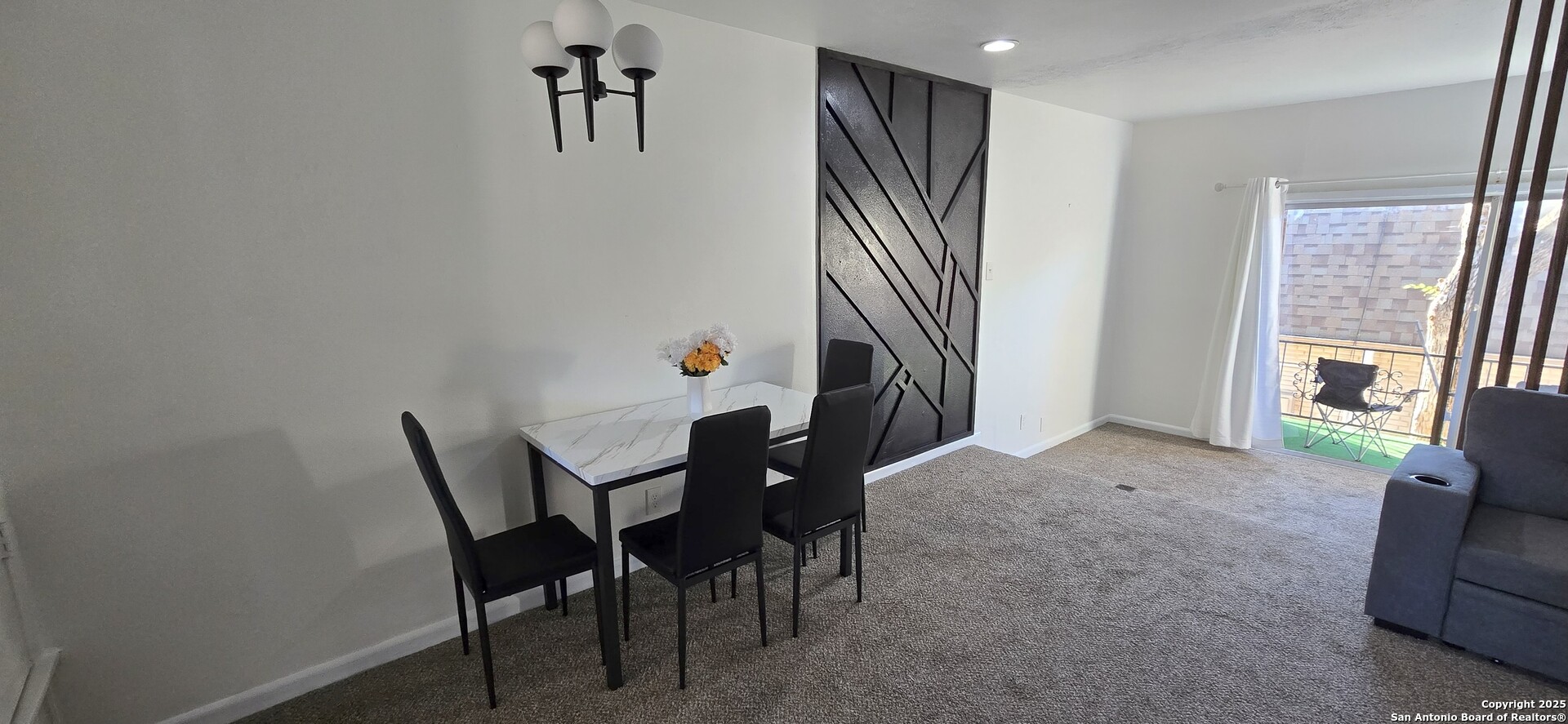 170 De Chantle Road, Unit 609 San Antonio, TX 78201 - Photo 7 of 20 a view of a dining room with furniture and a window