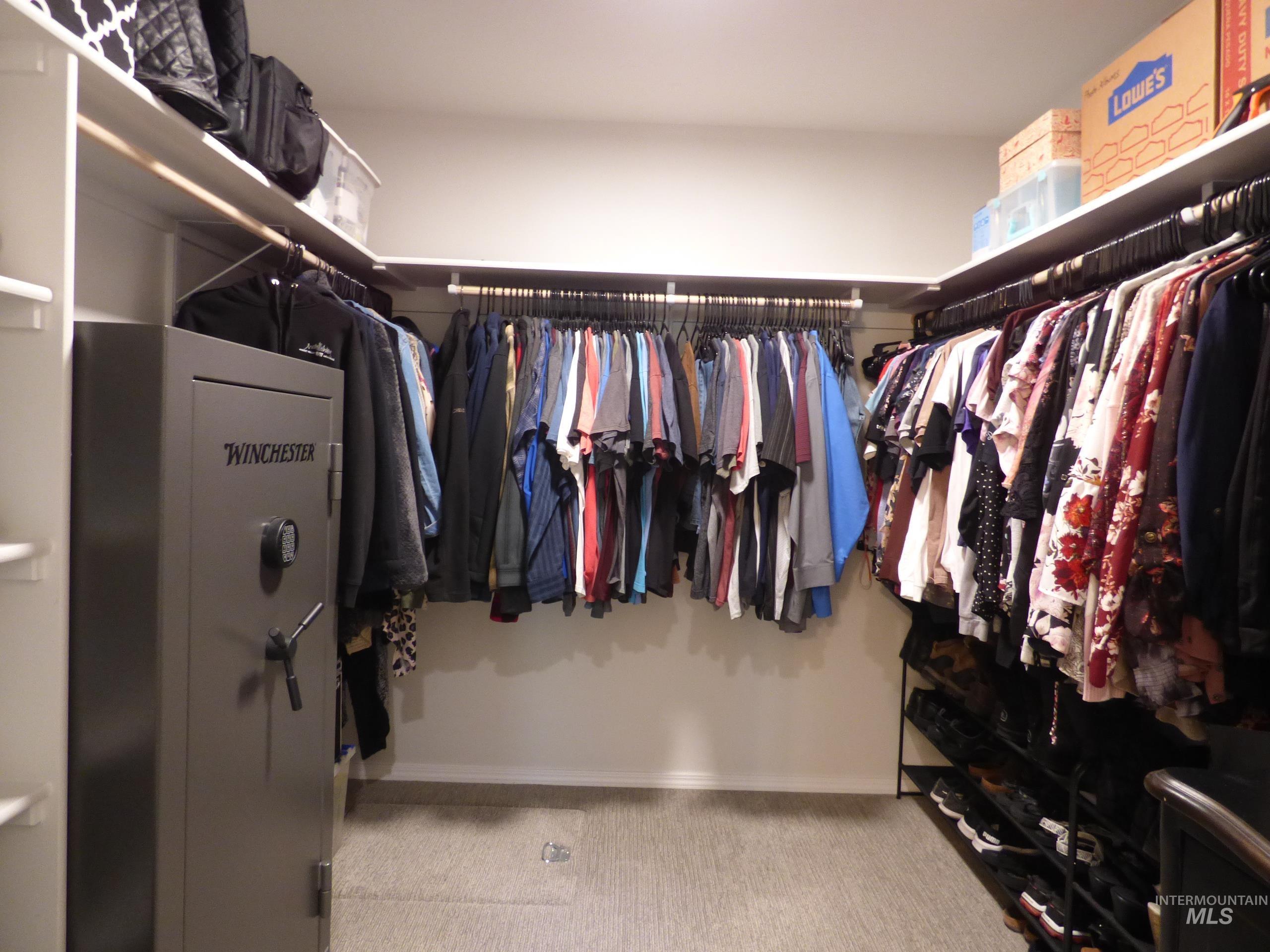 2708 East Buckaroo Drive Kuna, ID 83634 - Photo 22 of 48 Spacious walk-in closet featuring extensive built-in shelving and multiple clothing rods