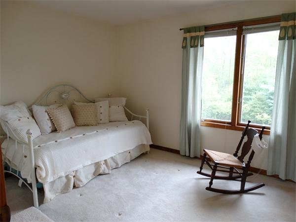 17 Grover Road Ashland, MA 01721 - Photo 23 of 26 a bedroom with a bed chair and window