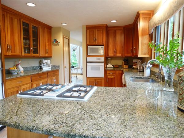 17 Grover Road Ashland, MA 01721 - Photo 8 of 26 a kitchen with stainless steel appliances granite countertop sink stove refrigerator and cabinets