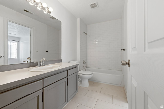 977 East 100 South Payson, UT 84651 - Photo 15 of 19 Bathroom featuring vanity, shower / bath combination, and light tile patterned floors