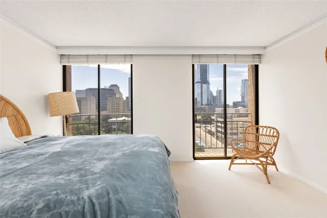 a bedroom with a bed and chair